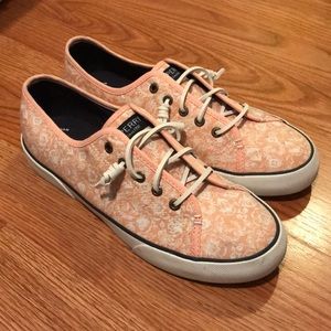 Sperry slip on sneakers.